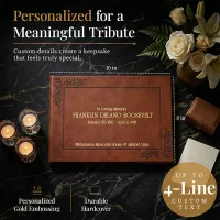 Personalized Funeral guest book with gold embossed “In Loving Memory” text on a brown leather hardcover, displayed with candles and flowers, showing custom details and 10x8 inch size for a meaningful tribute keepsake.