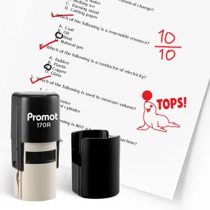 Black self inking stamp and removable cap displayed beside a graded science worksheet marked with red check marks, a “10/10” score, and a seal balancing a ball with the word “TOPS!” The worksheet includes multiple choice science questions, and this ink st