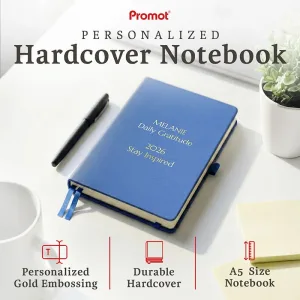 Blue personalized leather journal with custom gold embossed text, displayed on a desk to highlight its durable hardcover and A5 size.
