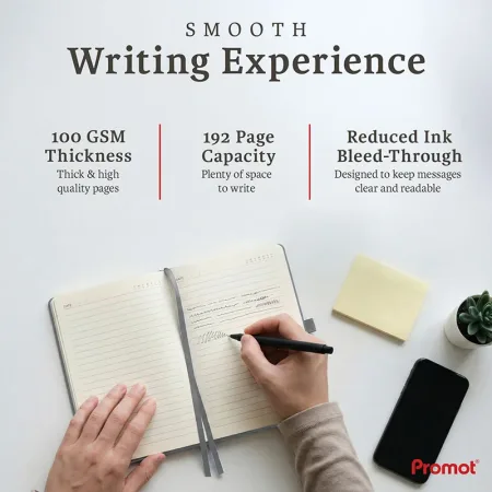 Open notebook with lined pages being written on beside a phone, a personalized leather journal with thick paper and smooth writing.