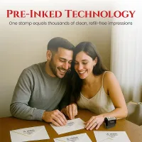 Large personalized address stamp used by a couple addressing envelopes at a table with pre-inked impressions
